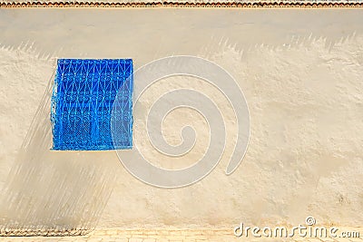 Window with ornate blue bars in Sidi Bou Said, Tunisia. Wall background, copy space Stock Photo