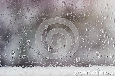 Window pane during a rain with sleet Stock Photo