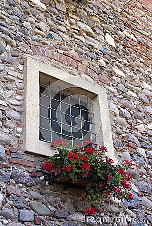 Window and red geraniums Stock Photo