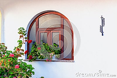 Window and red geraniums Stock Photo