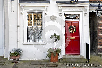 Window with red shutters, decorated with a drawing with a horse in a traditional Christmas style about south bank in London Editorial Stock Photo