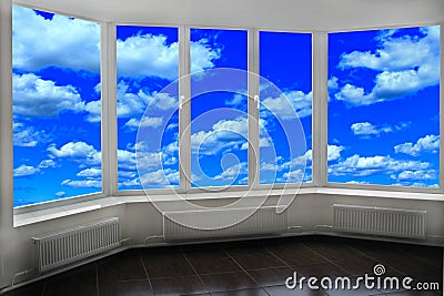 Window of room overlooking blue sky with white clouds. Heavenly landscape Stock Photo