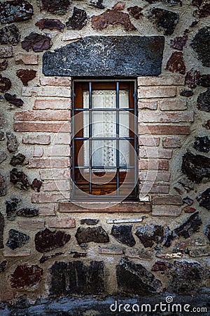 Window rustic house with railings. Protection from thieves Stock Photo