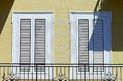 Window with shutters closeup view, sunny day on sea resort Stock Photo