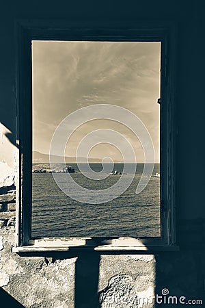 Window to the sea in an abandoned house and across the islands, the Aegean sea, FoÃ§a, Phokai, IzmirTurkey Stock Photo