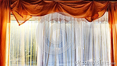 Window with transparent white tulle beige curtains. Background and texture with fabric and copy space for text Stock Photo