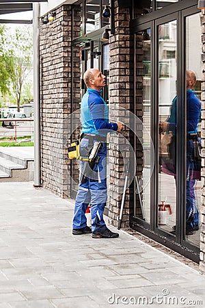 Window washer working at building outdoor Stock Photo