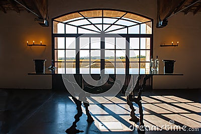 Window in Wine Cellar in Bordeaux with view to vineyards Stock Photo