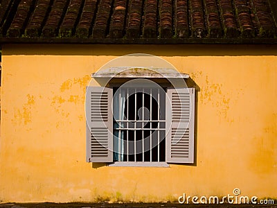 Window in Yellow Wall Stock Photo