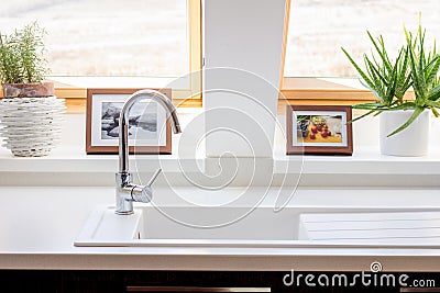 Windows in white contemporary kitchen Stock Photo