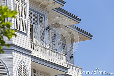 Windows with white wooden shutters on wall building, Turkey Stock Photo