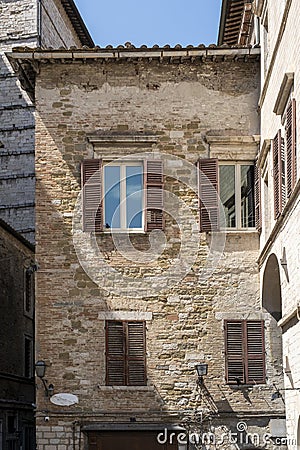 Windows in a yellow old brick wall Stock Photo