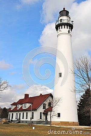 Windpoint Lighthouse portrait with blue sky and clouds. Stock Photo