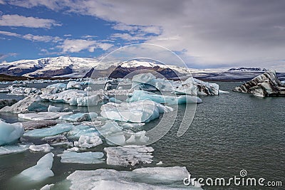 Winds push ice burgs at Jokulsarlon Glacier Lagoon in Iceland Stock Photo