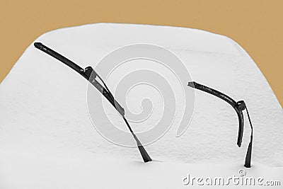 Windscreen wipers of a vehicle covered in snow Stock Photo