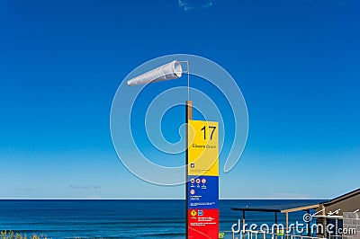 Windsock and information board. High wind on the beach Editorial Stock Photo