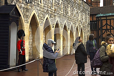 Queen`s Guard outside the Guard Room at Windsor Castle UK Editorial Stock Photo