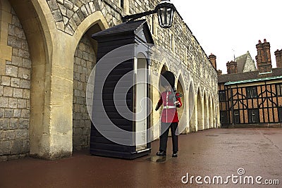 Queen`s Guard outside the Guard Room at Windsor Castle UK Editorial Stock Photo
