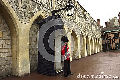 Queen`s Guard outside the Guard Room at Windsor Castle UK Editorial Stock Photo