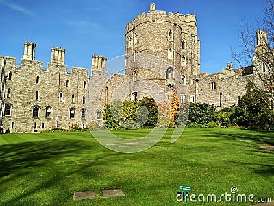 Windsor / Great Britain - November 02 2016: Walls, buildings and towers of the Windsor Castle on a sunny day Editorial Stock Photo
