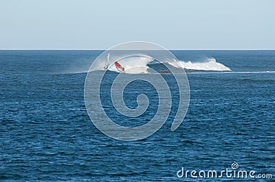 Windsurfer sailing in the coast of Fuerteventura. Editorial Stock Photo