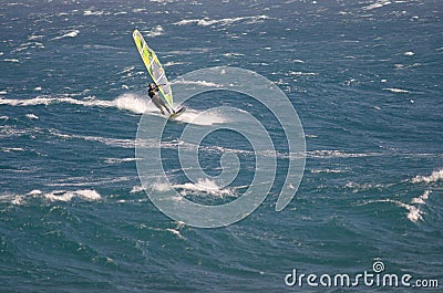 Windsurfer sailing in the sea. Editorial Stock Photo