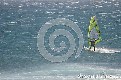 Windsurfer sailing in the sea. Editorial Stock Photo