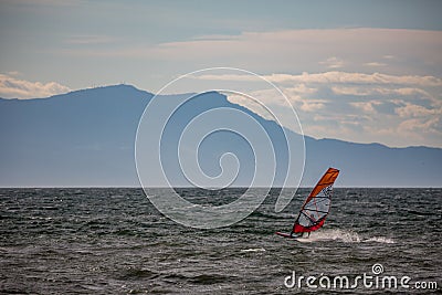 Windsurfer silhouette in Thracian sea at winter Editorial Stock Photo