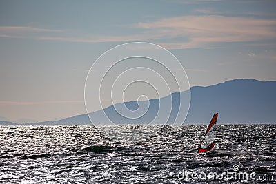 Windsurfer silhouette in Thracian sea at winter Stock Photo