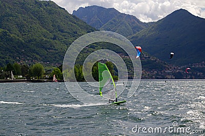 windsurfers on Lake Como with mountains Editorial Stock Photo