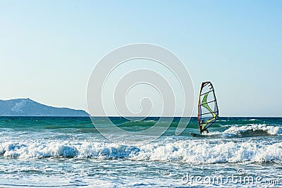 Windsurfers in the sea on Crete on sunset. Windsurfing in Heraklion Editorial Stock Photo