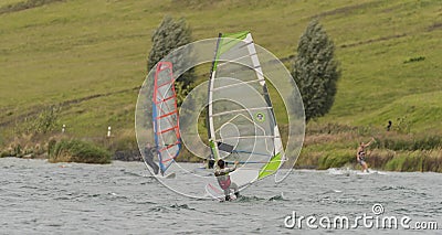 Windsurfing on Milada lake in wind day Editorial Stock Photo