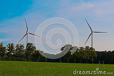 Windturbines in a rural environment Stock Photo