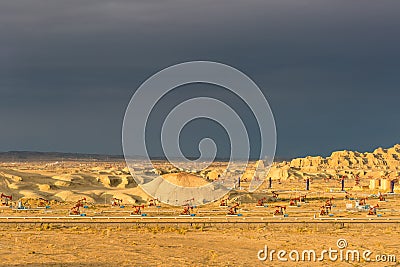 Xinjiang windy city oil field in sunset Stock Photo