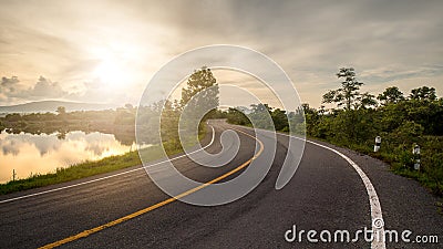 Windy road and sunrise Stock Photo