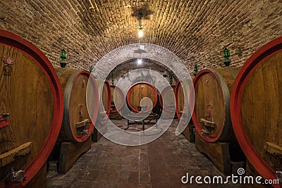 Wine barrels (botti) in a Montepulciano cellar, Tuscany Stock Photo