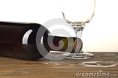 Wine bottle and glass on wooden background Stock Photo