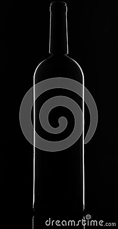 A wine bottle silhouette on black background with smooth reflections Stock Photo