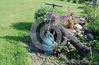 Wine bottle wrapped blue twig and stylized opener Stock Photo