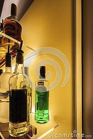 Wine bottles on shop rackes Stock Photo