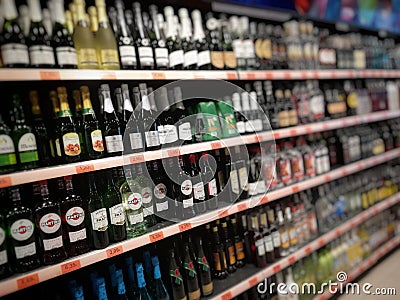 wine bottles on supermarket shelves Editorial Stock Photo