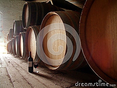 Bottle of wine on cellar floor Stock Photo