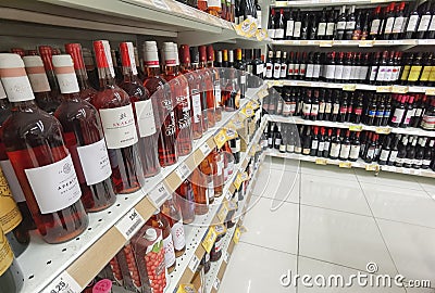 Wine cellar in super market shelf many bottles and wines Editorial Stock Photo