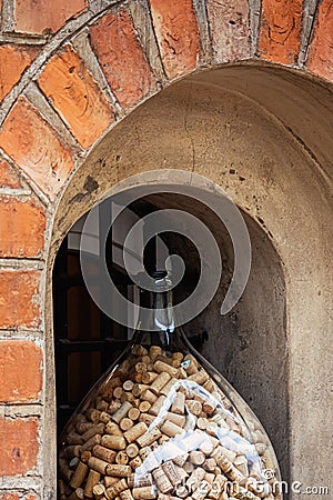 Wine corks in a huge glass jar, a decoration of winery in the old town of Vilnius, Lithuania Editorial Stock Photo