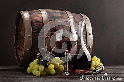 Wine decanter, glass and old wooden barrel Stock Photo