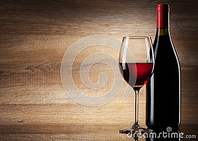 Wine glass and Bottle on a wooden background Stock Photo