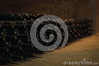 Wine glass bottles fermenting in winery cellar Stock Photo