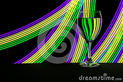 Wine glass with neon light behind Stock Photo