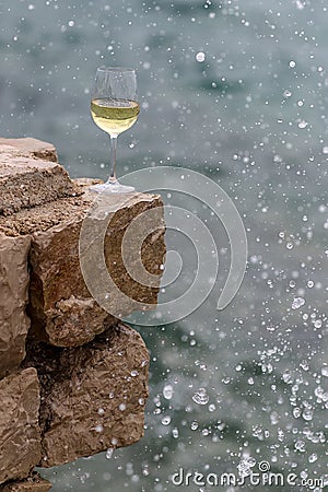 Wine glass in splashes Stock Photo