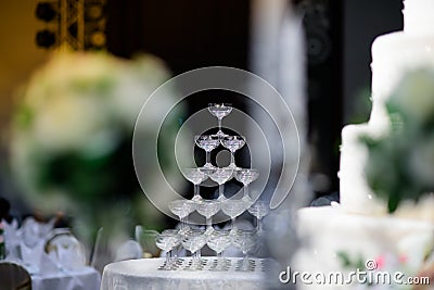 Wine glasses are arranged high in the party. Stock Photo